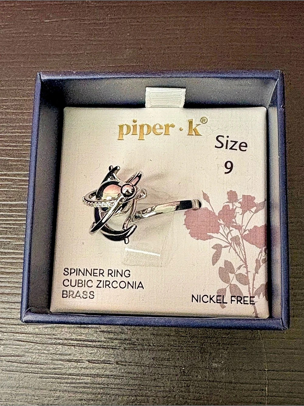 piper k Spinner Ring Cubic Zirconia Brass Size 9 Silver tone Size 9. New in box